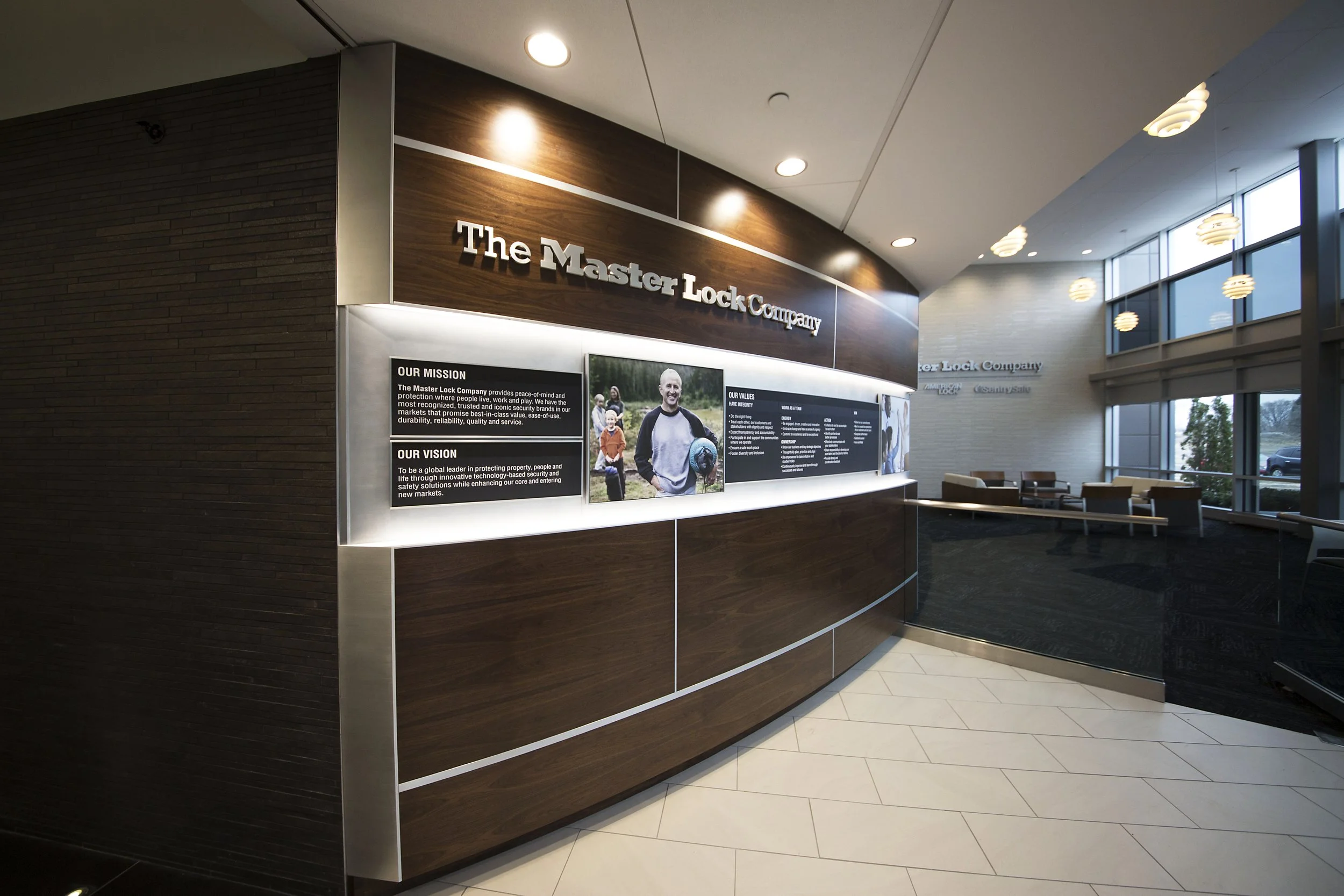 Branded corporate interior featuring custom environmental graphics and dimensional architectural elements.