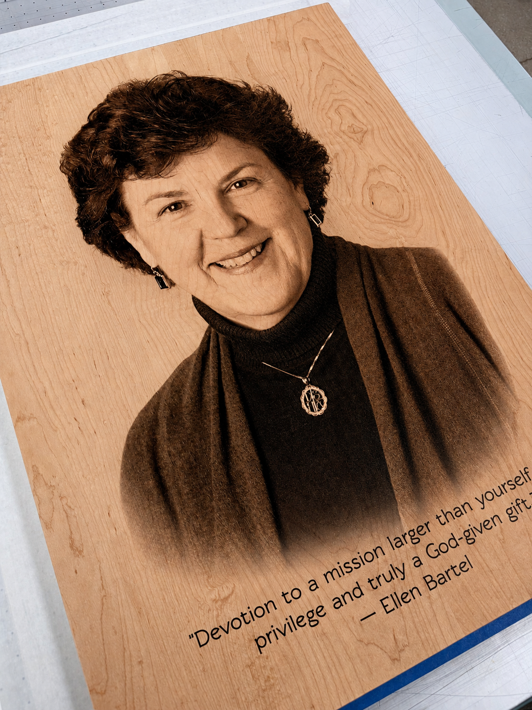 Portrait and interpretive text printed directly onto a finished wood panel.
