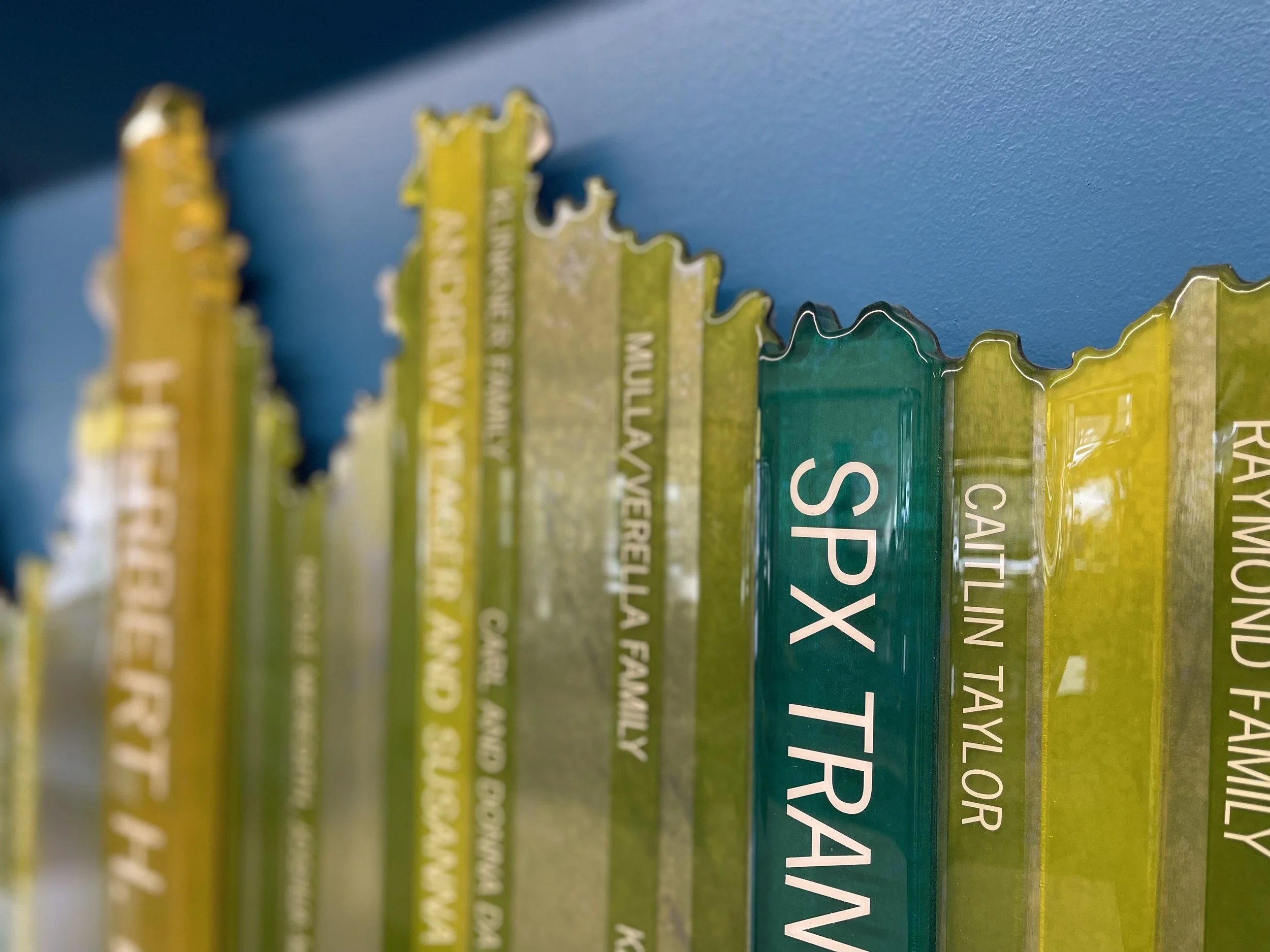Cut vinyl donor names applied to colorful translucent dimensional recognition elements.