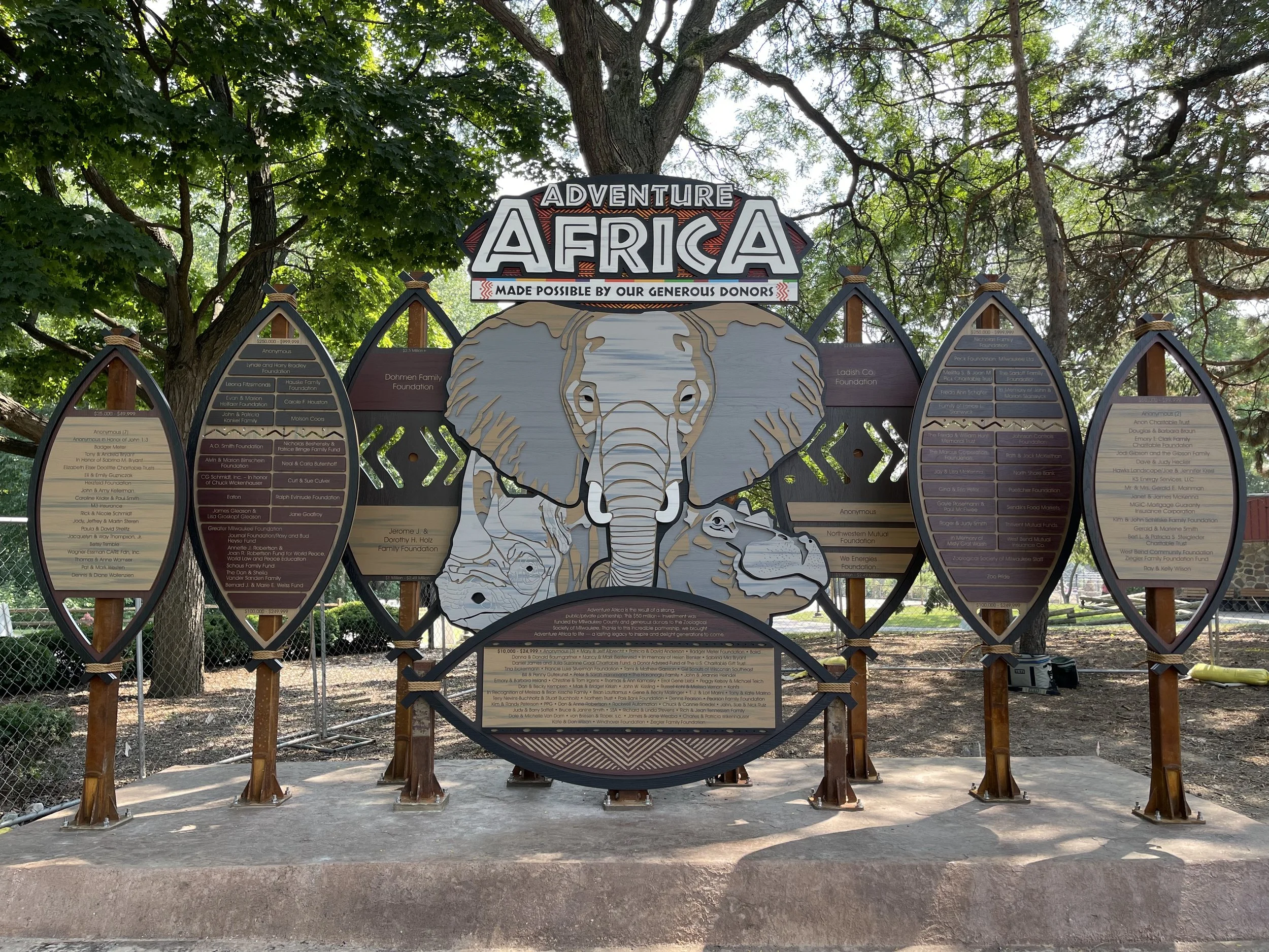 Custom Adventure Africa donor recognition installation at the Milwaukee County Zoo featuring an elephant centerpiece and integrated donor panels.