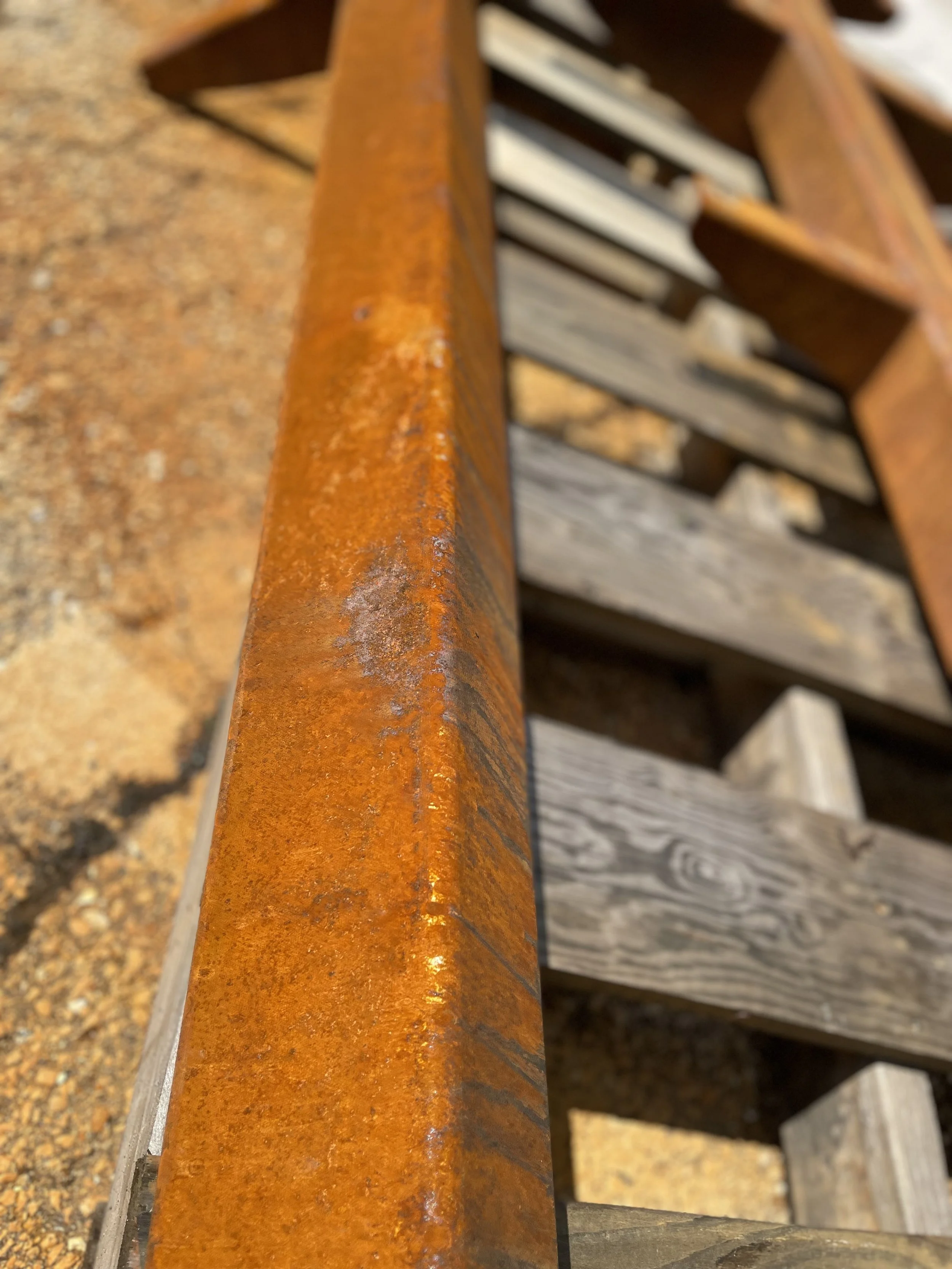 Close-up of the intentionally weathered Corten steel finish used for the outdoor Adventure Africa donor recognition structure.