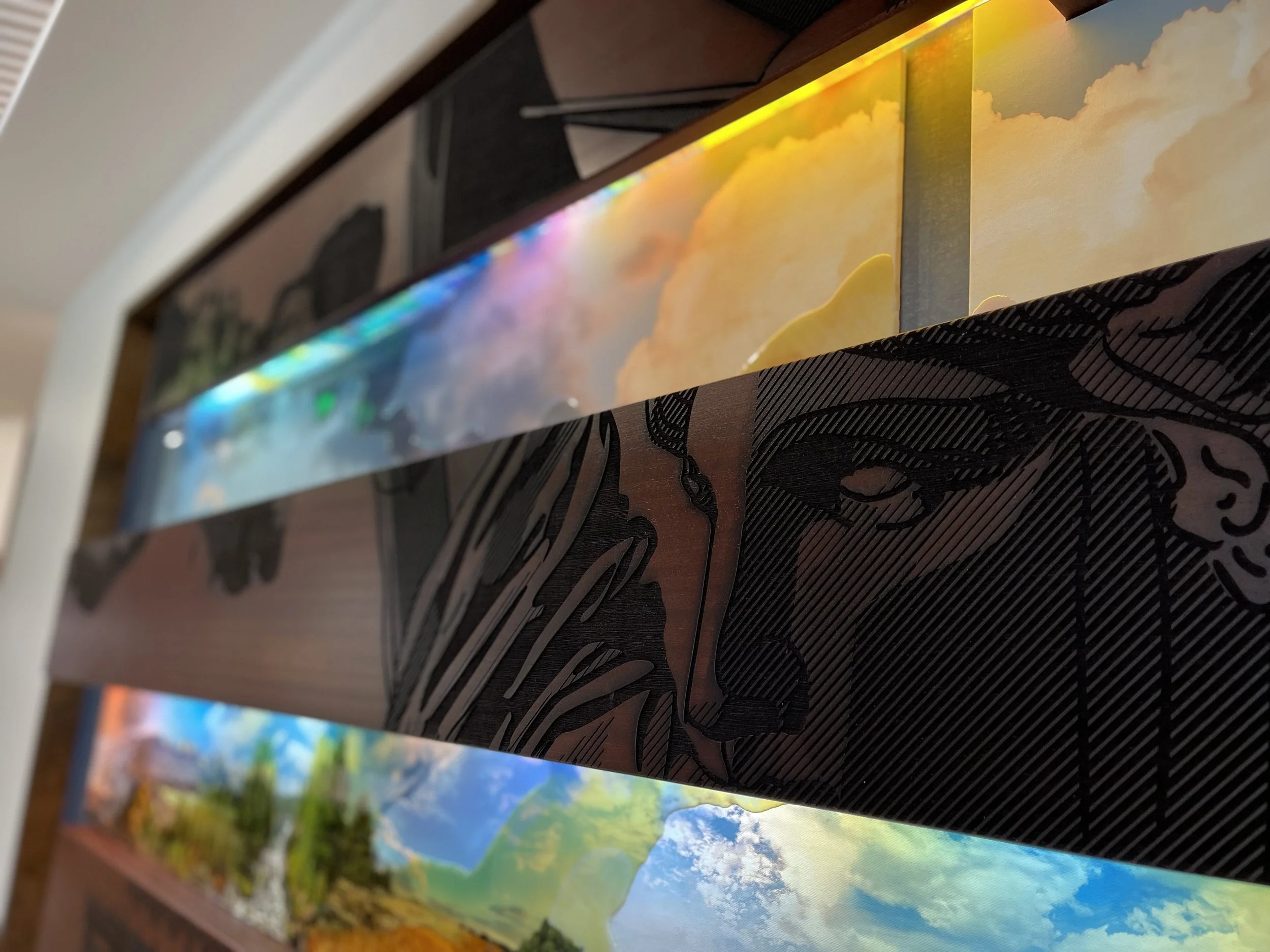 Layered wood, printed graphics, and integrated LED lighting used together in a custom experiential installation.