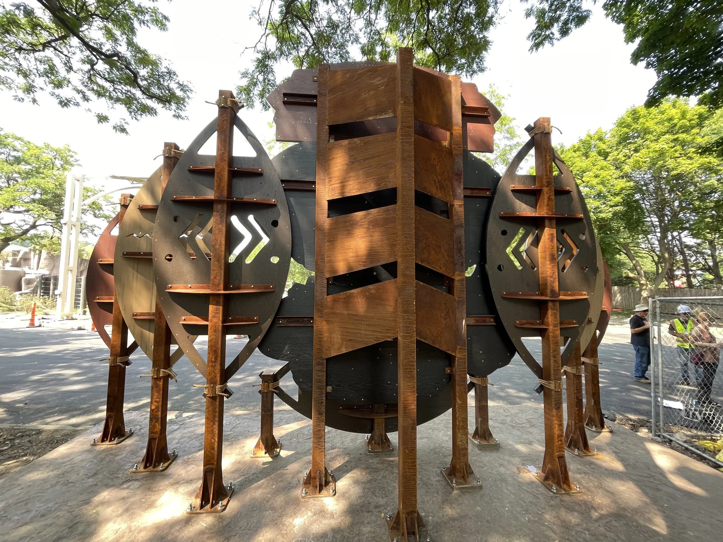 Rear view of the Adventure Africa donor recognition installation showing its Corten steel support structure and layered construction.