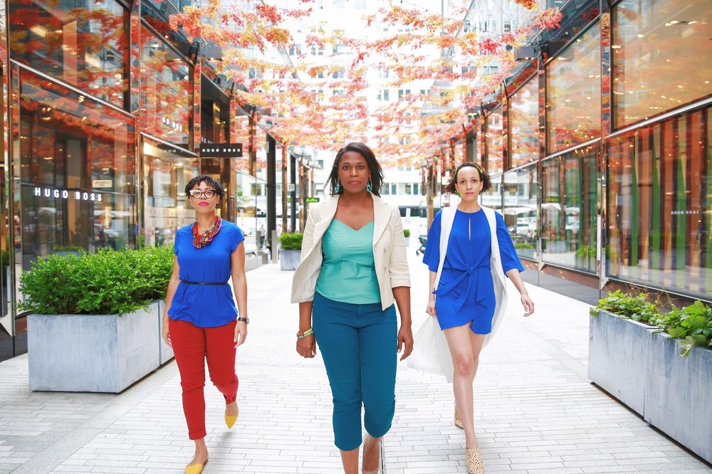3 Black women walking facing the camera in City Center, Washington, D.C. Photos: Milli Mike / Millgrimage