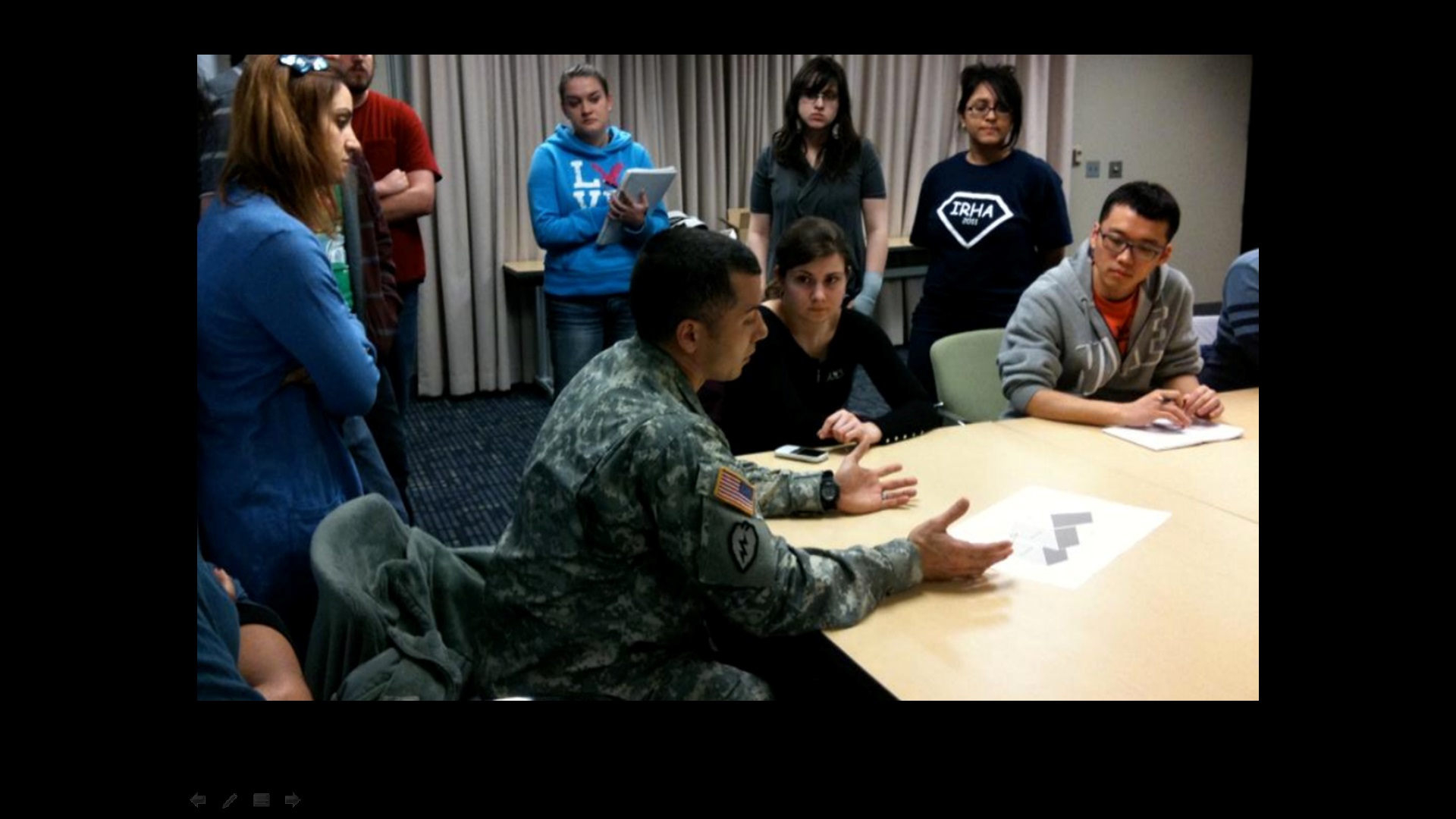 The M.O.R.E design team meeting with Sgt. Delgado to review and enhance our design.