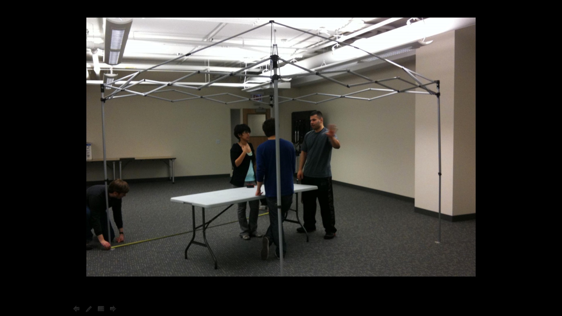 Here are a few of us at the Idea shop, hashing out the details as we start to create our first full - scale prototype.