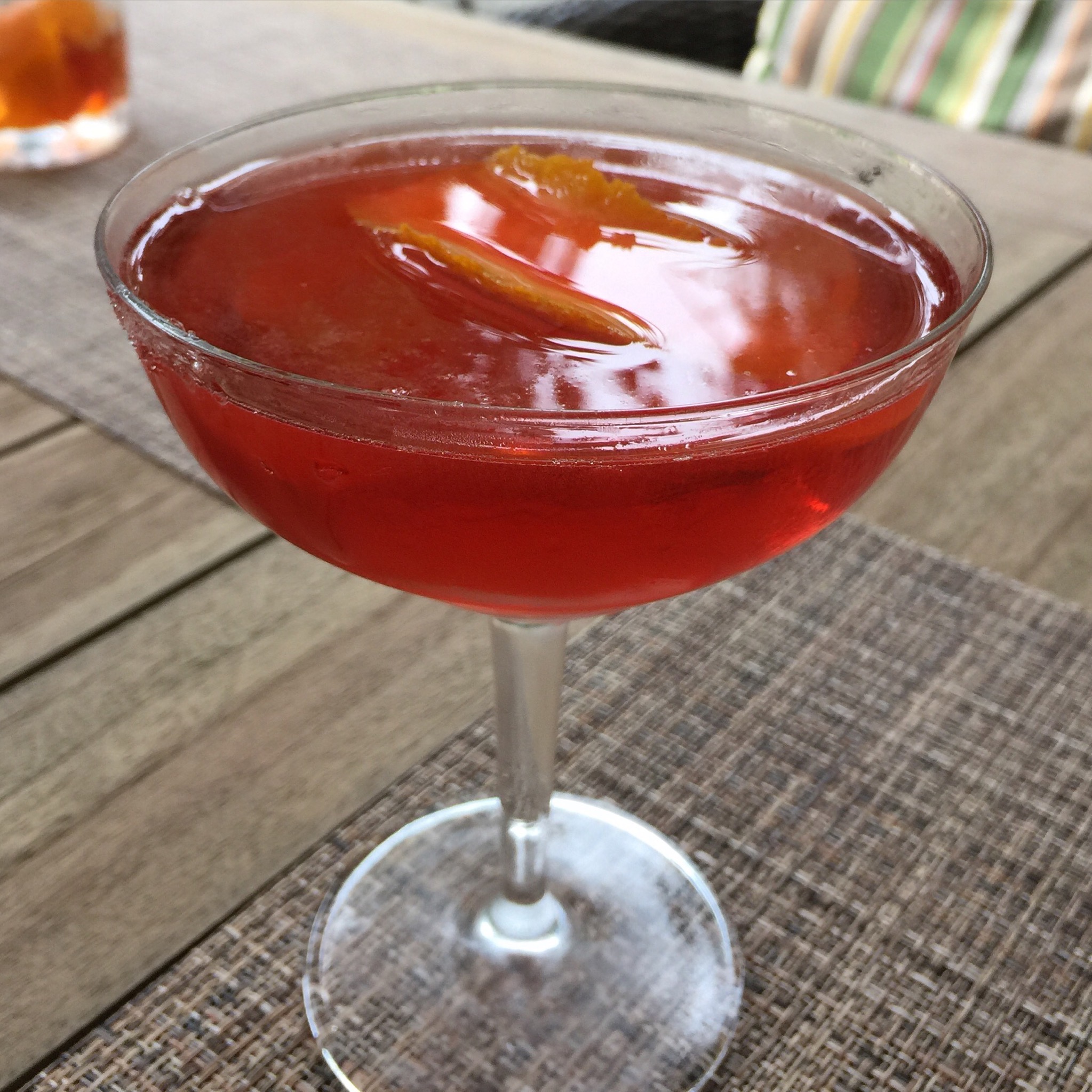 Negroni 1.5 ounces Junipero gin 3/4 ounce Compari 3/4 ounce sweet vermouth 1 piece of orange zest with pith Combine all the liquid ingredients in an icefield cocktail shaker. Stir gently for 20 to 30 seconds, until cold, and then strain into a chilled cocktail glass. Flame the orange zest over the drink and float it on top.