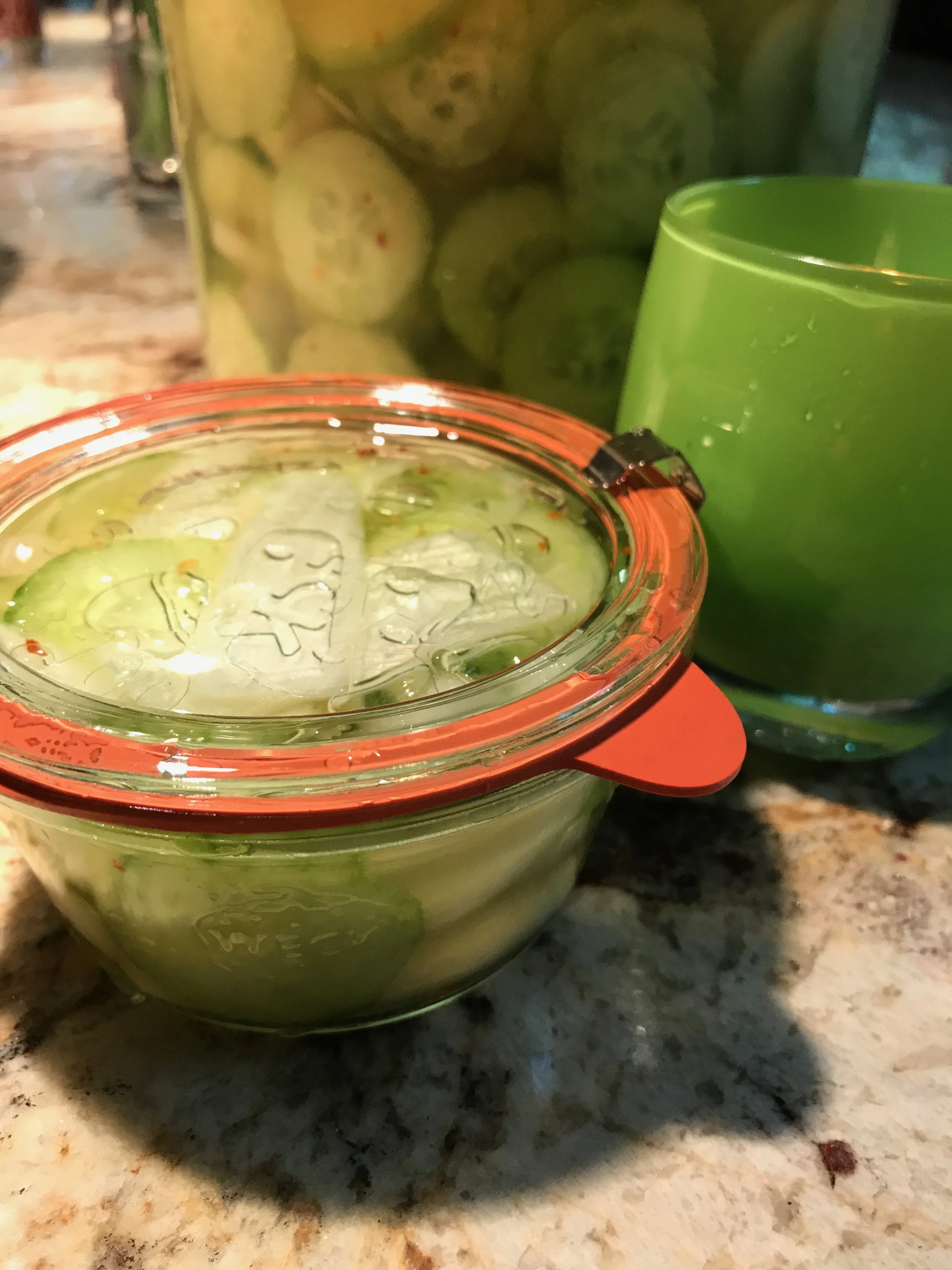 "My Dad's Pickled Cucumbers and Onions!" 4 decent sized cucumbers, peeled and cleaned 1 Large onion cut into the shape you like to eat them 4 Cups Apple Cider Vinegar (The Cheaper, the Better) 1/8 Cup Sugar (Your call on this, I like it...my dad added more!) 2 tsp Salt 2tsp fresh ground pepper 1 tsp red pepper flakes (my dad would roll over in his...heavenly home if he knew I put these in) Put all these ingredients in a decent tub. Large Tupperware™ type of container. It's about half a gallon at the end of the day. Let these ingredients sit for a good couple o' days. However, I eat some the second I add all the stuff. Makes me feel like a kid again. Enjoy!