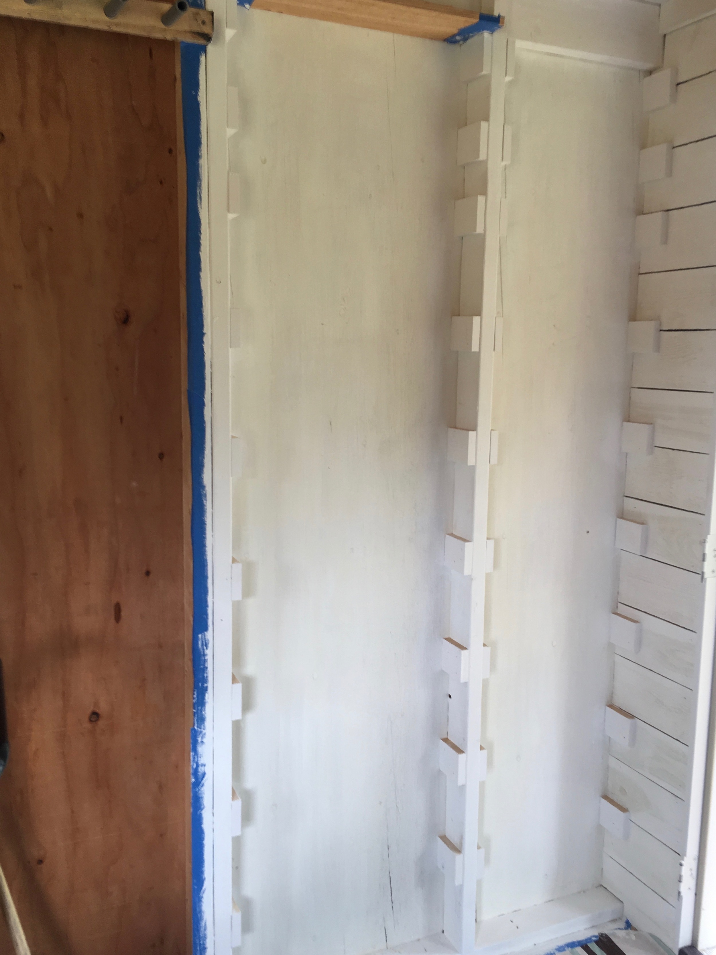 Shelf braces installed and painted