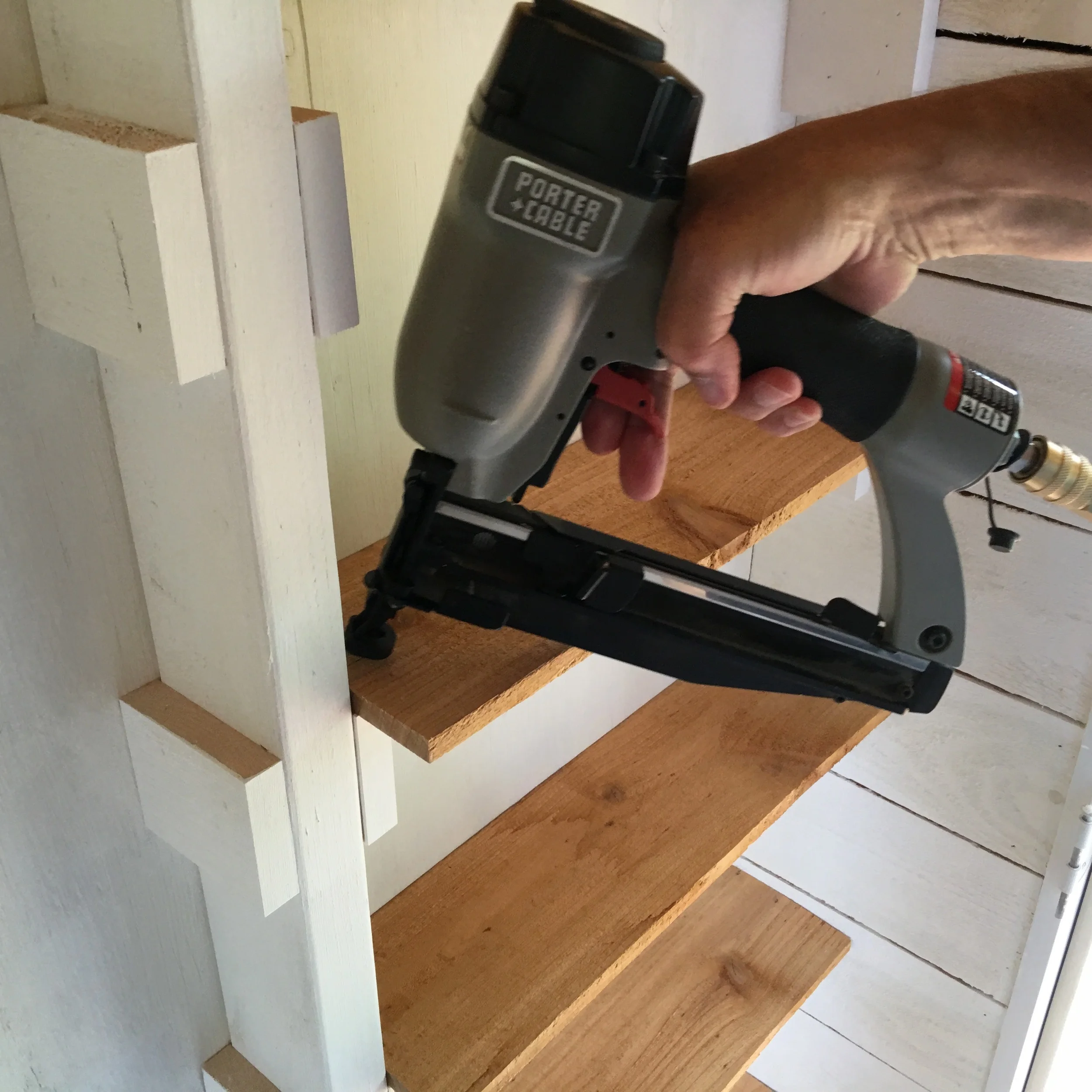 Tim installing the shelves.
