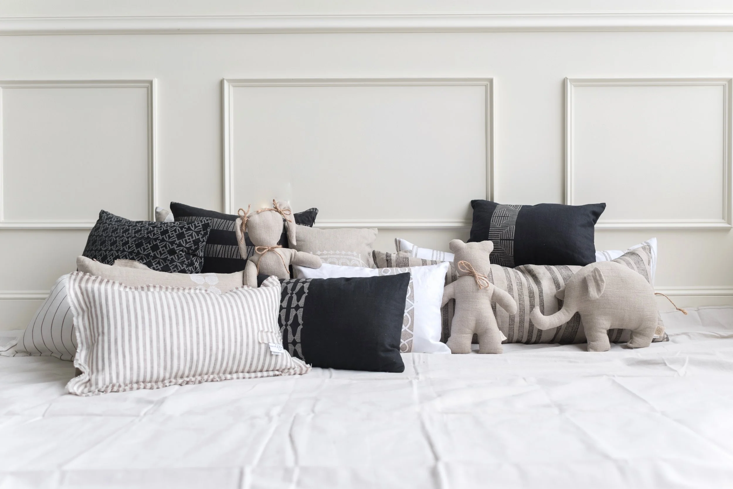 Soft Animal Toys on Linen Bedding