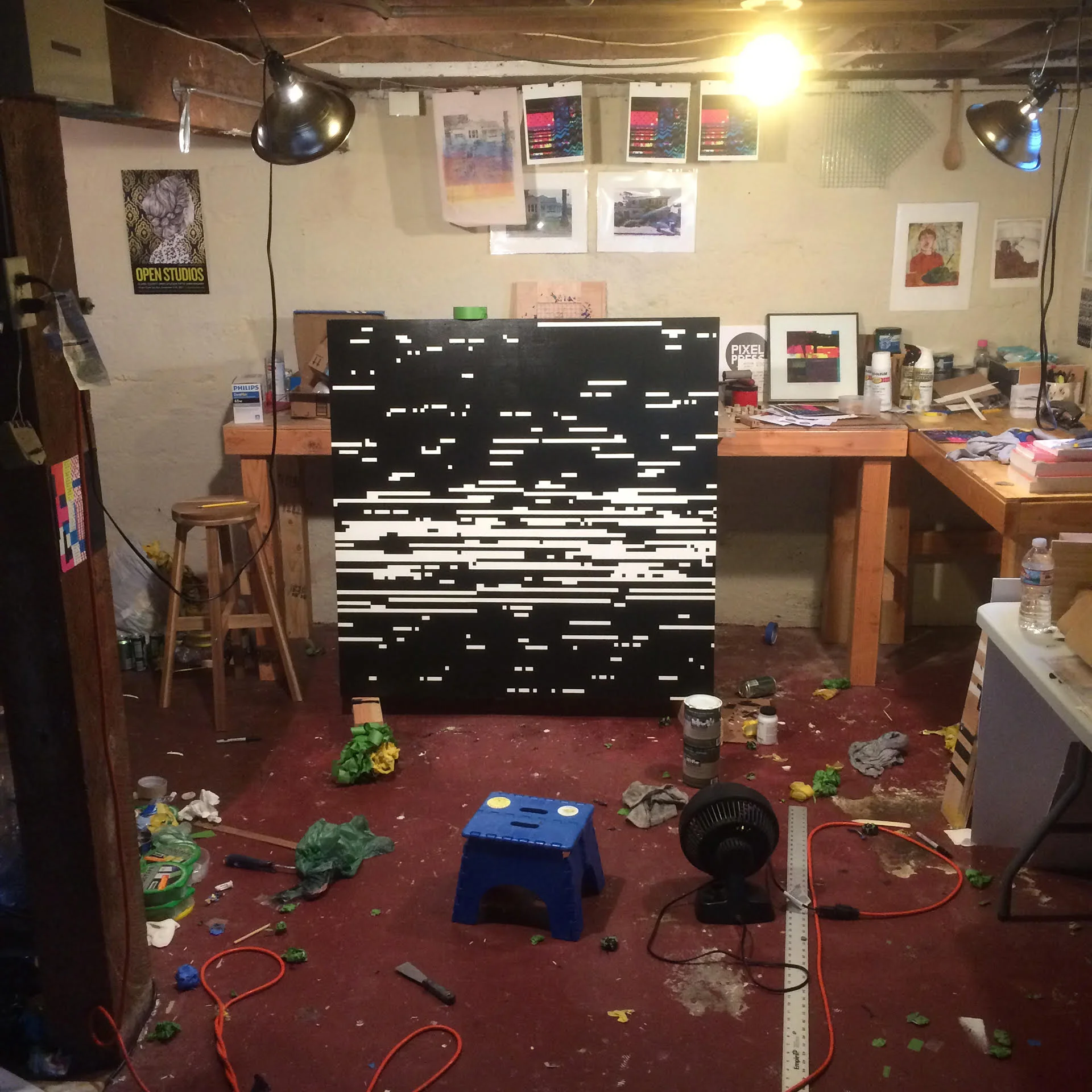 My immaculate studio with a painting I made using a stencil.
