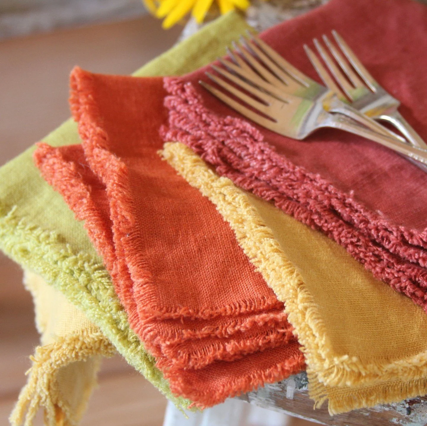 My favorite kind of decorating&mdash;folded linen, layering texture, and letting the light do the rest.