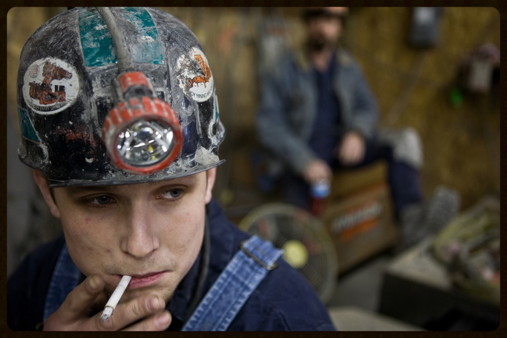 "king coAL'A PRECARIOUS REIGN" - Coal miner Chuck Ewing smokes a cigarette before his shift at the Tusky coal mine in Urichsville, Ohio. Seventy men work at the Tusky underground coal mine in rural Eastern Ohio, caught between the growing consequences of global climate change and the limited employment choices in a still-depressed economy. PHOTO CREDIT: KAYANA SZYMCZAK