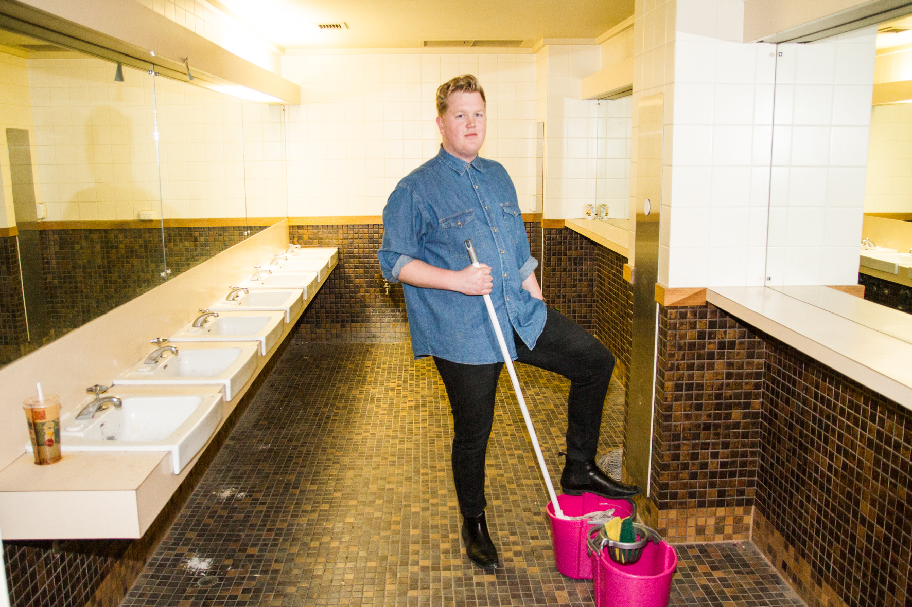 Oli Kirk poses as a cleaner on a piss break.