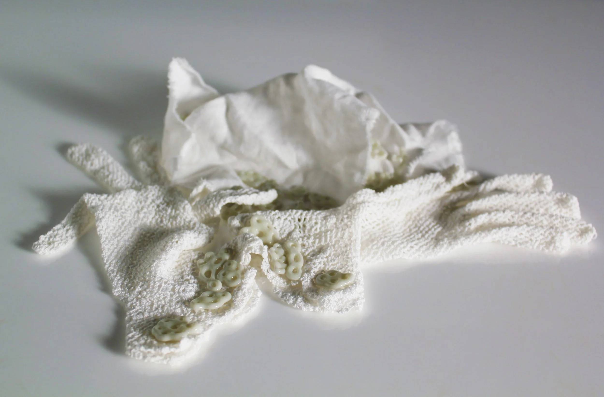 Ursula Halpin,An lá a bhfuair mé bás, (the day I died) 2017, linen handkerchief, artist own first Holy Communion gloves and pâte de verre glass beads, photo courtesy the artist.
