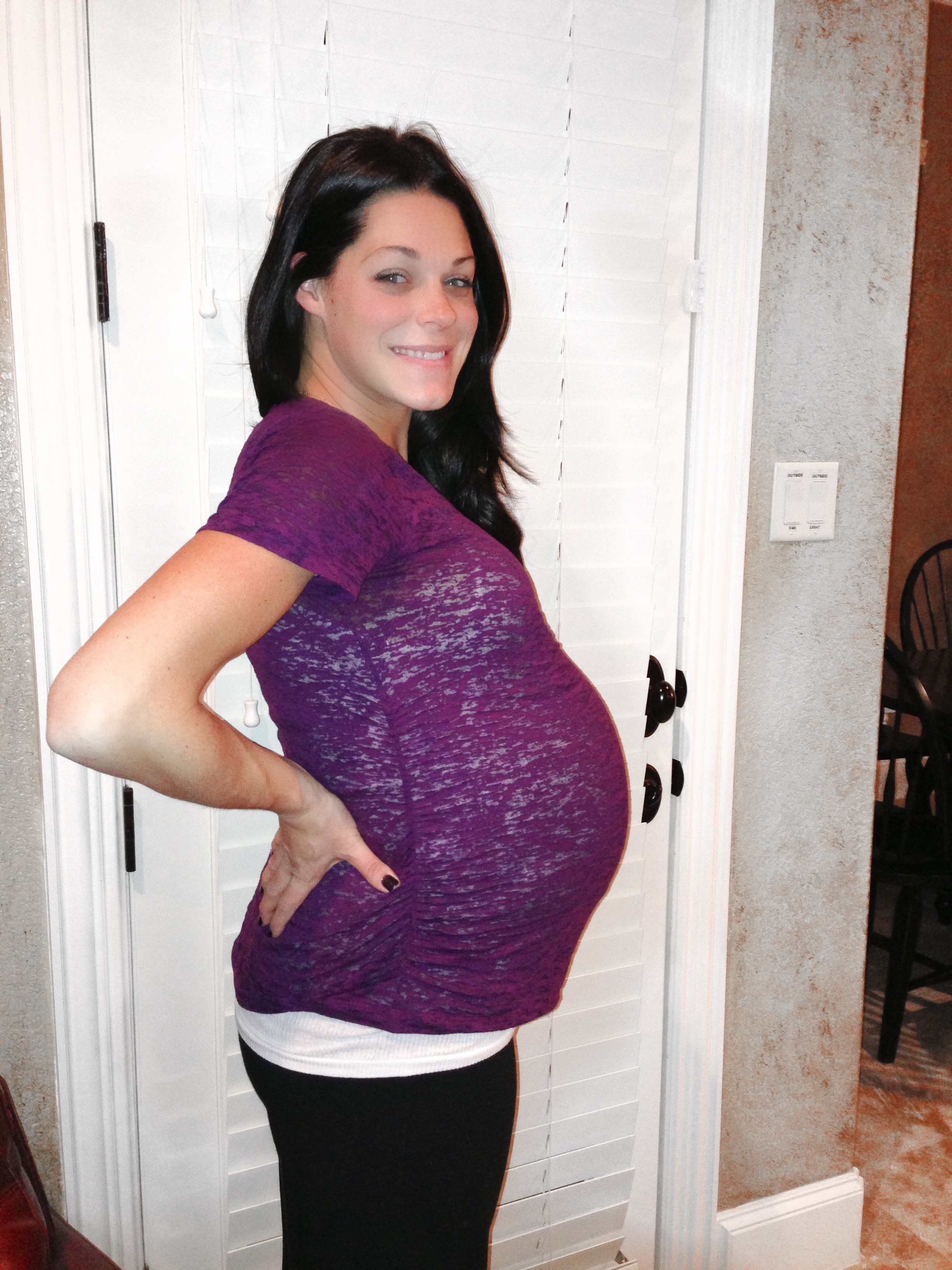 pictured at 31 weeks pregnant with triplets 