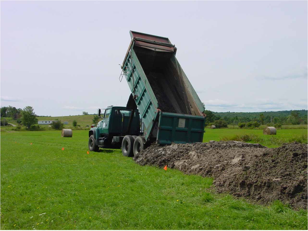  Stockpiling Class B biosolids for application between cuts of hay, central Maine. 