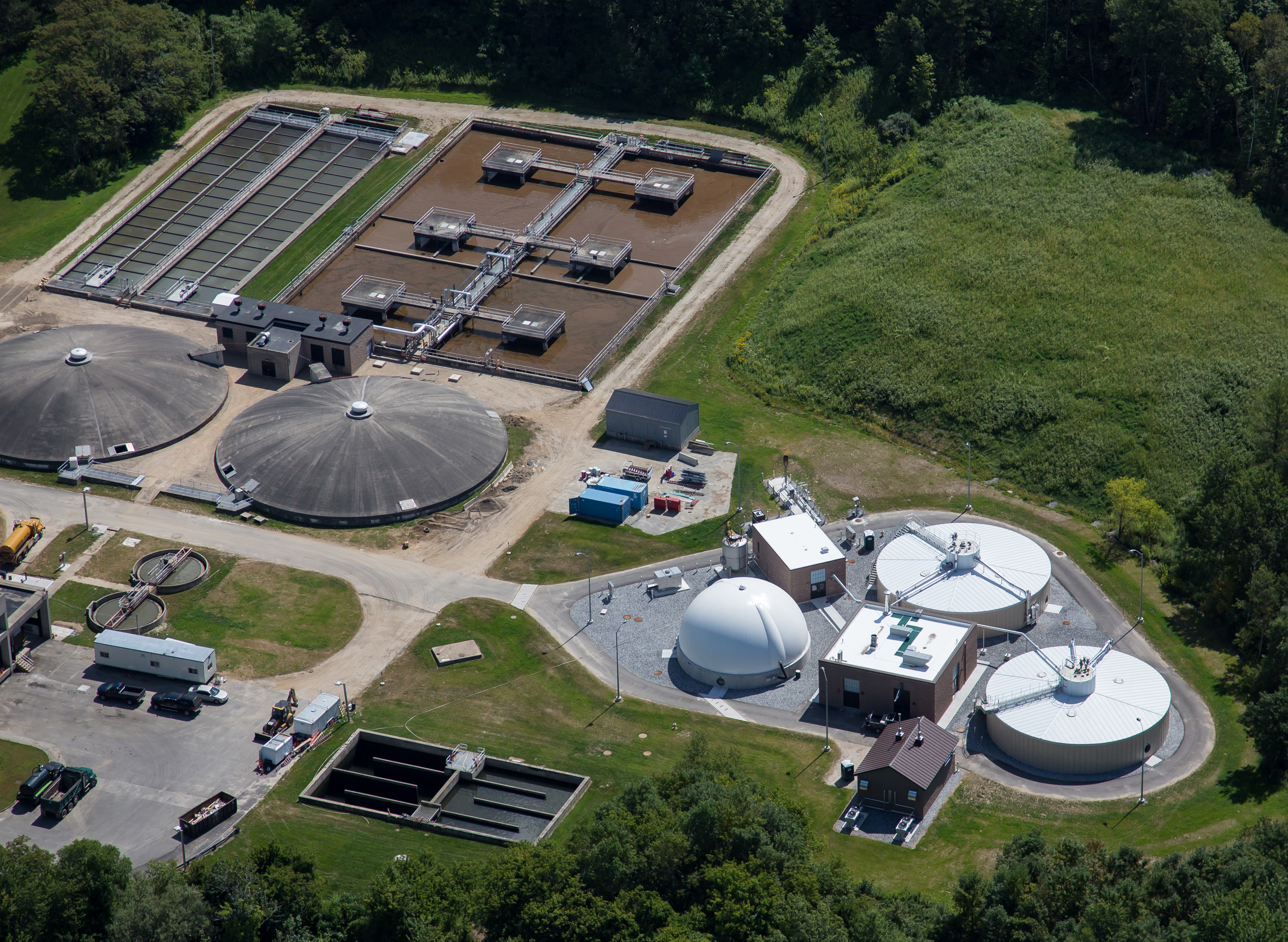 The LAWPCA water resource recovery facility, with the new anaerobic digestion complex at the right (white gas dome & 2 round digesters).