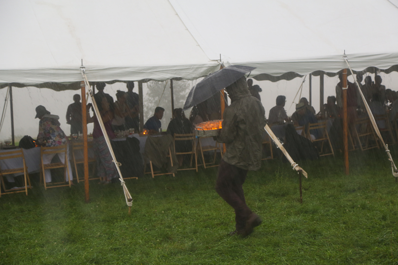  Dinner out in a field means braving the unpredictable elements. 