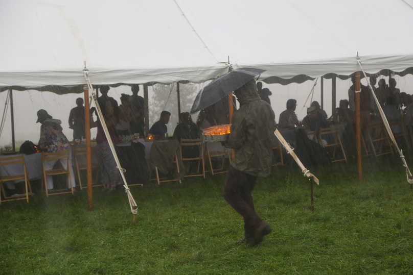 Dinner out in a field means braving the unpredictable elements.