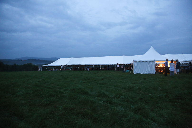  The forecast called for finding a rare tent that could cover one long table that seats two hundred people. The openness allowed people to enjoy the rain and the view... and stay dry. 