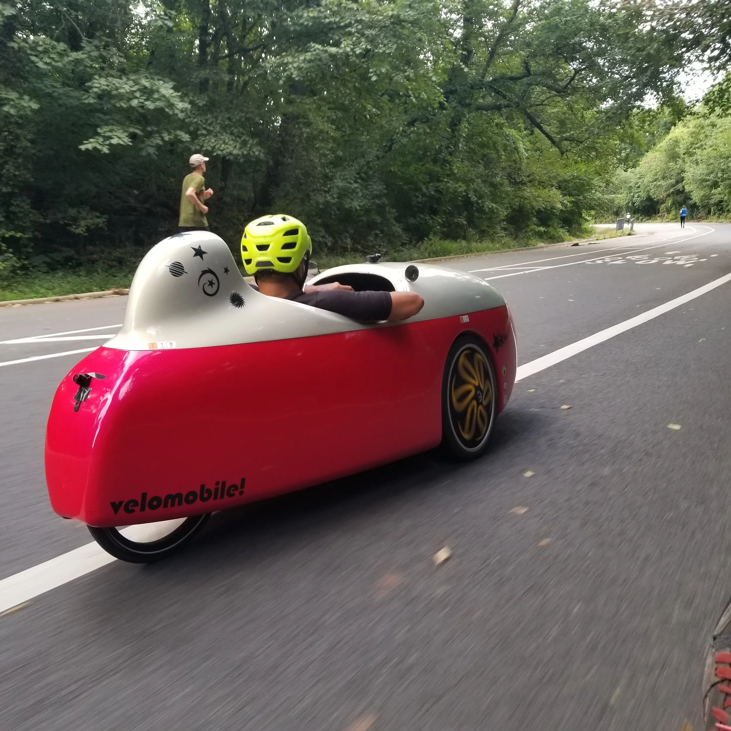 Mr Dubin, riding his Velomobile that just received new suspension and struts at 718 Cyclery