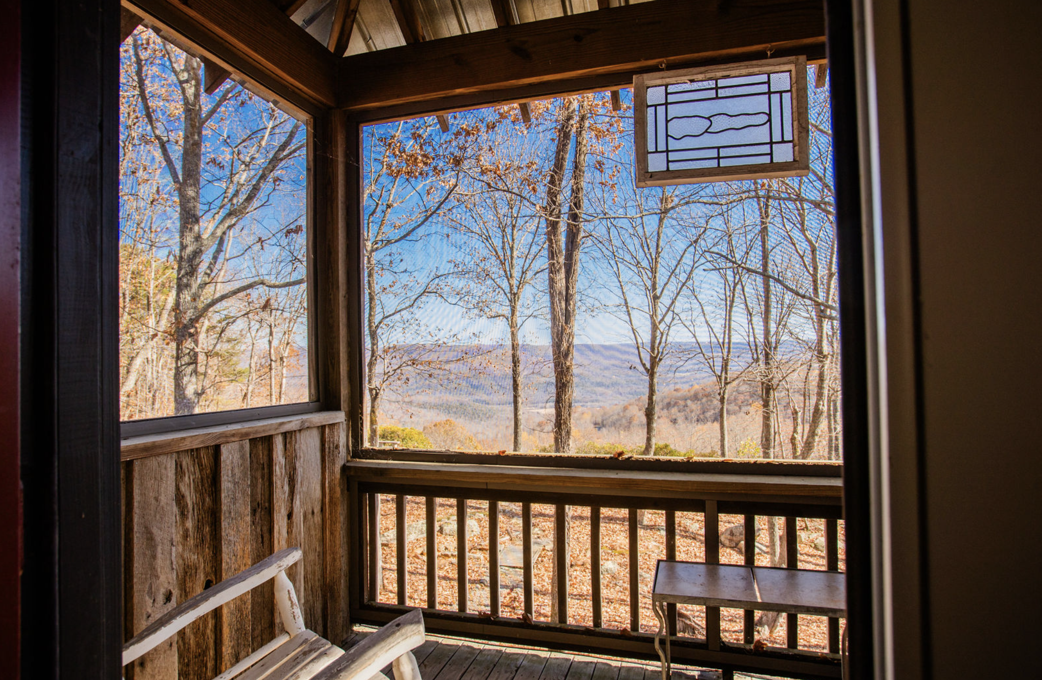 Whispering Falls Private Master Suite balcony in the Main House at Rising Sun Retreat.