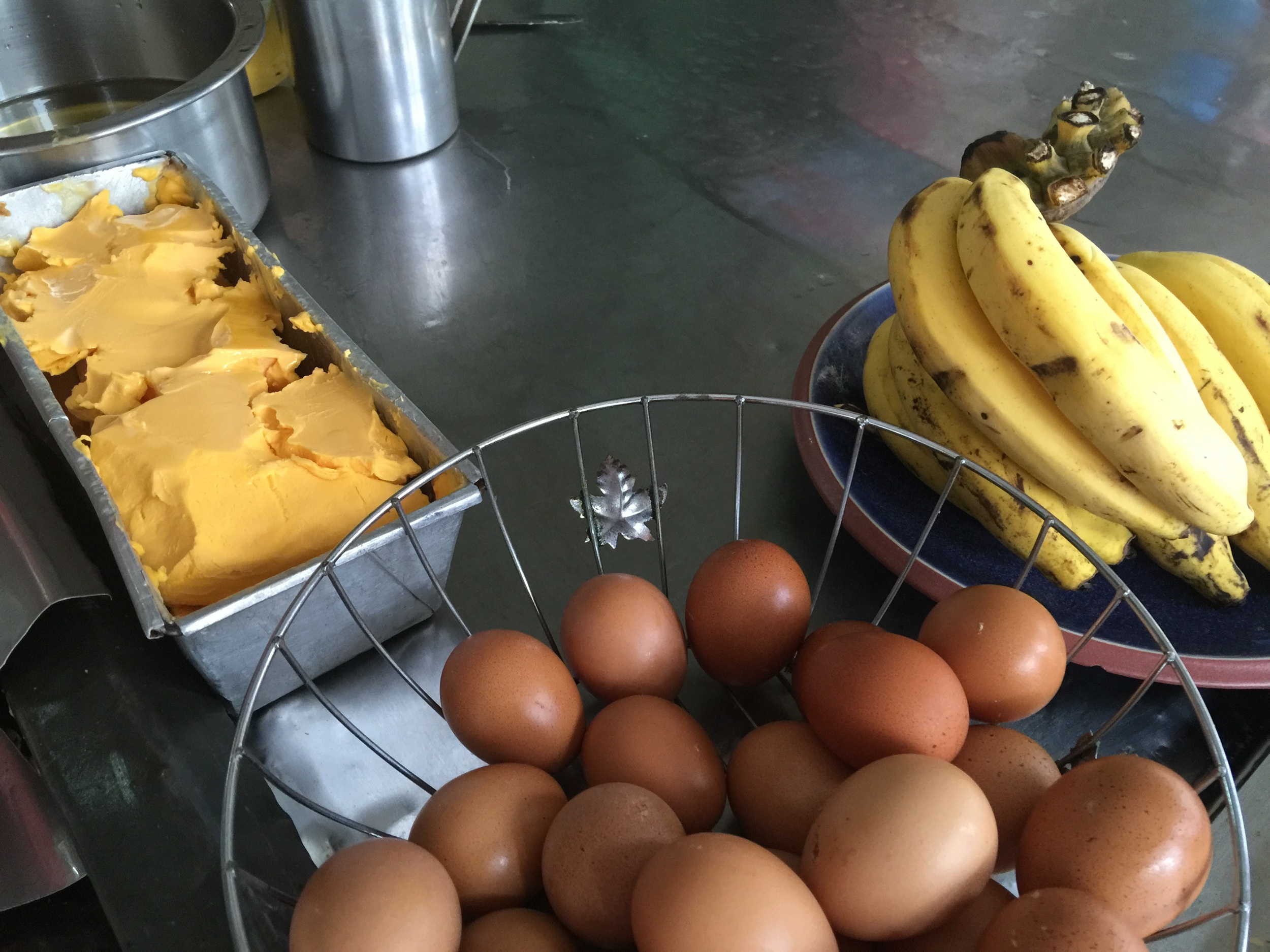 Eggs, banana, and a tub of orange lard. Only tasty goodness shall come of this!