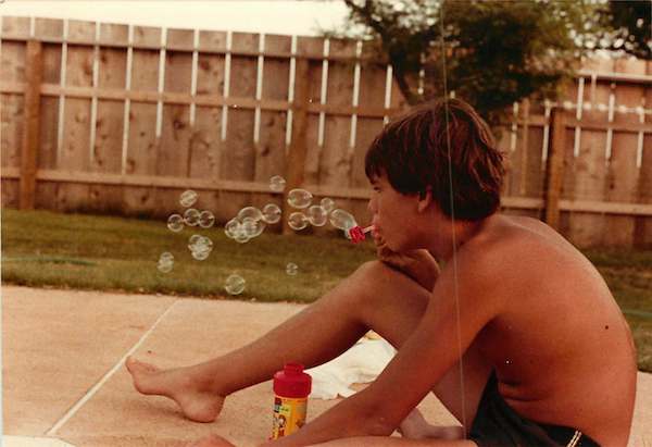 Why travel, when I can blow bubbles next to my pool? Image via Evo Terra’s mom.