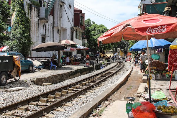 Life intermingles with train lines in Vietnam