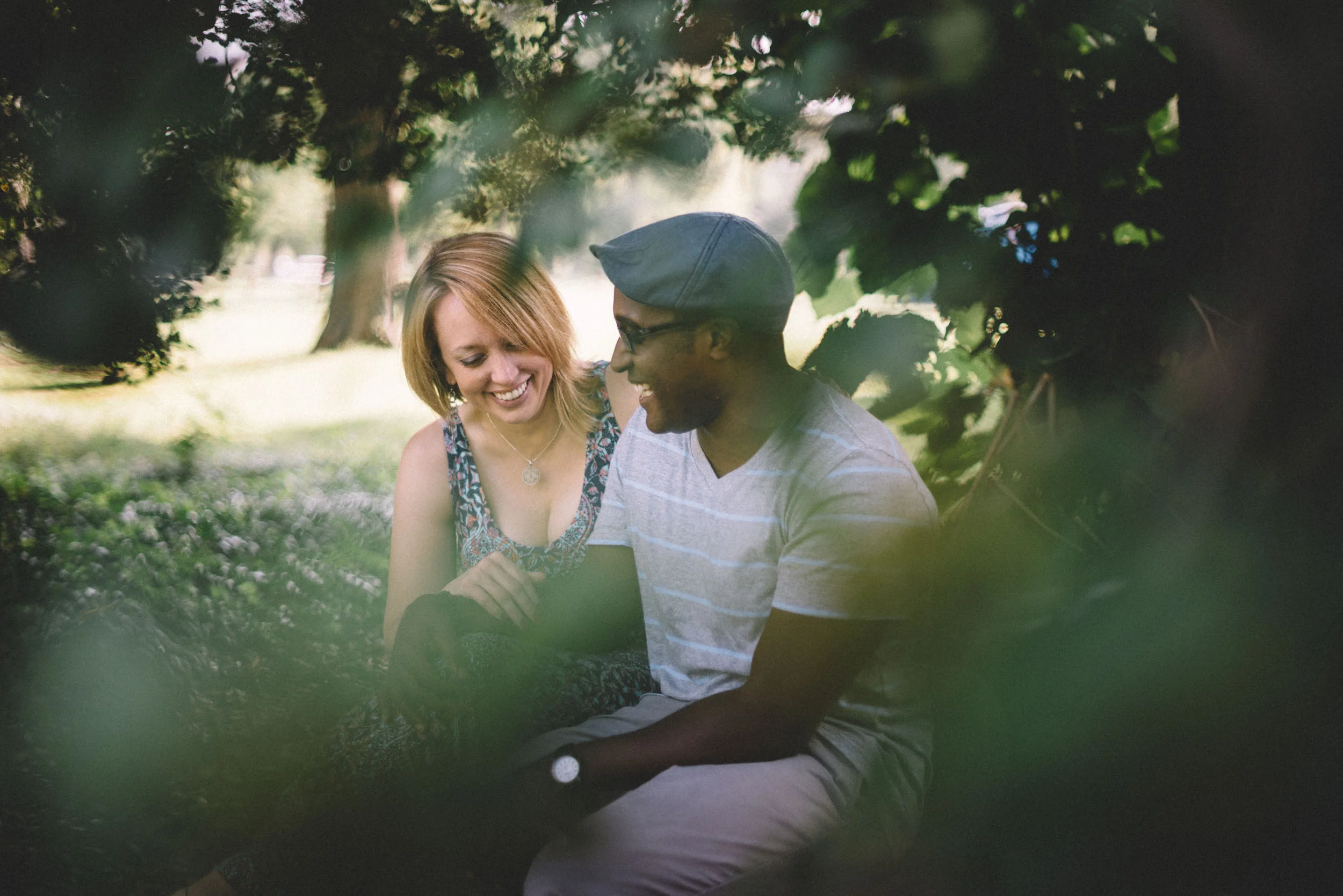 A Richmond, Virginia couple laugh during their engagement session.