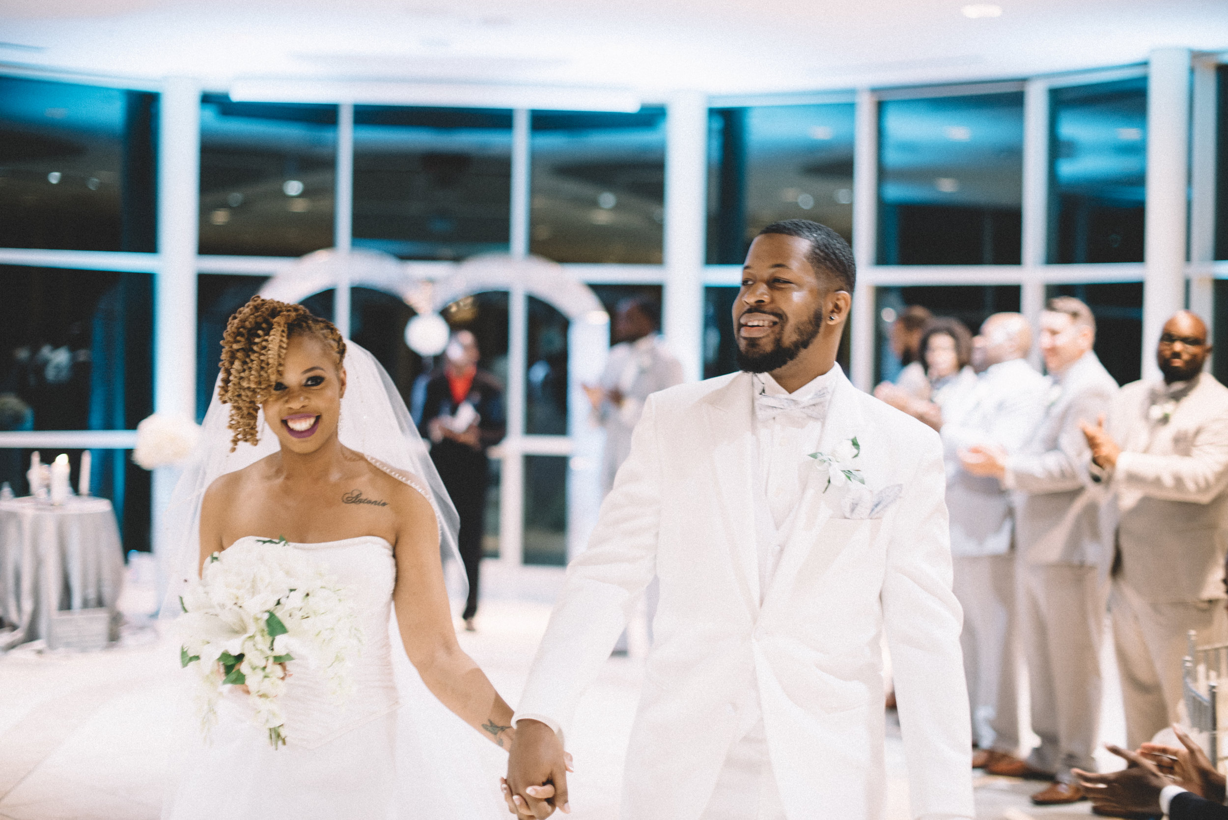 The bride and groom are married at Newton White Mansion in Mitchellville, MD