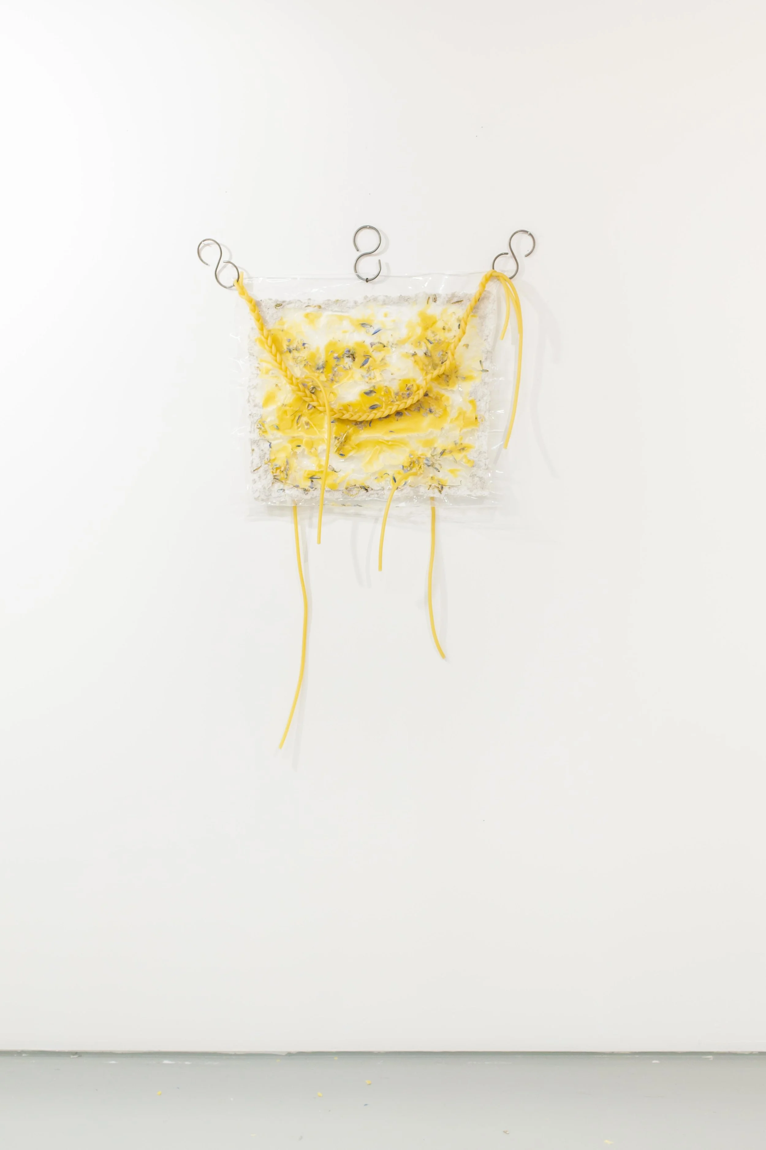 Chaleur Drama Act II , 2018, Plastic, beeswax, latex surgical tubing, cornflowers, s-hooks, 48” x 36”