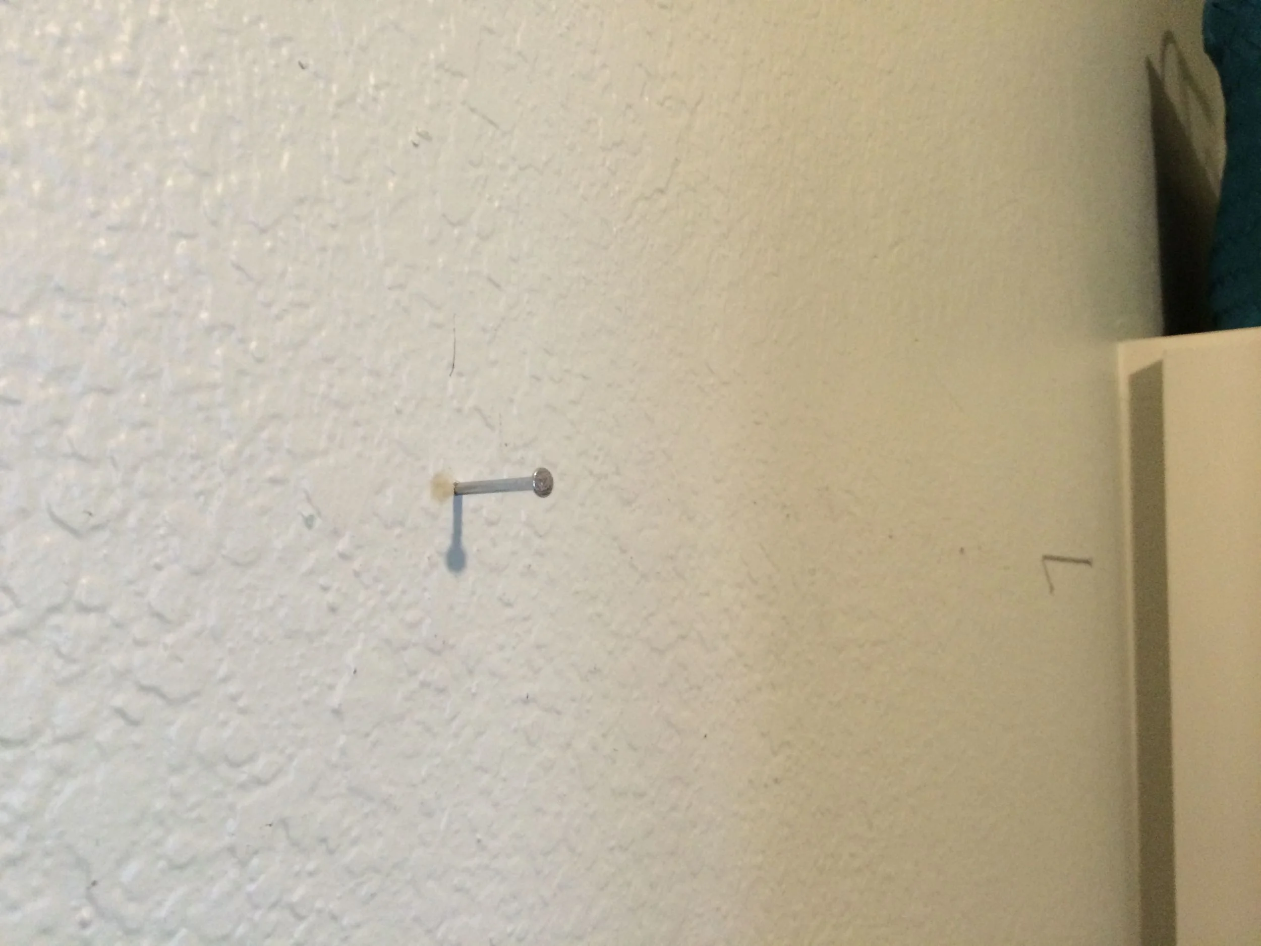 I hammered nails in to mark the studs.