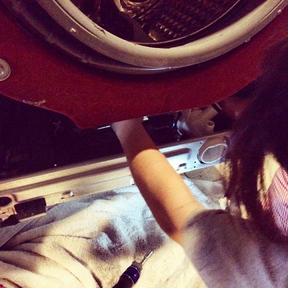 This is me... changing out the drain pump in the washer.