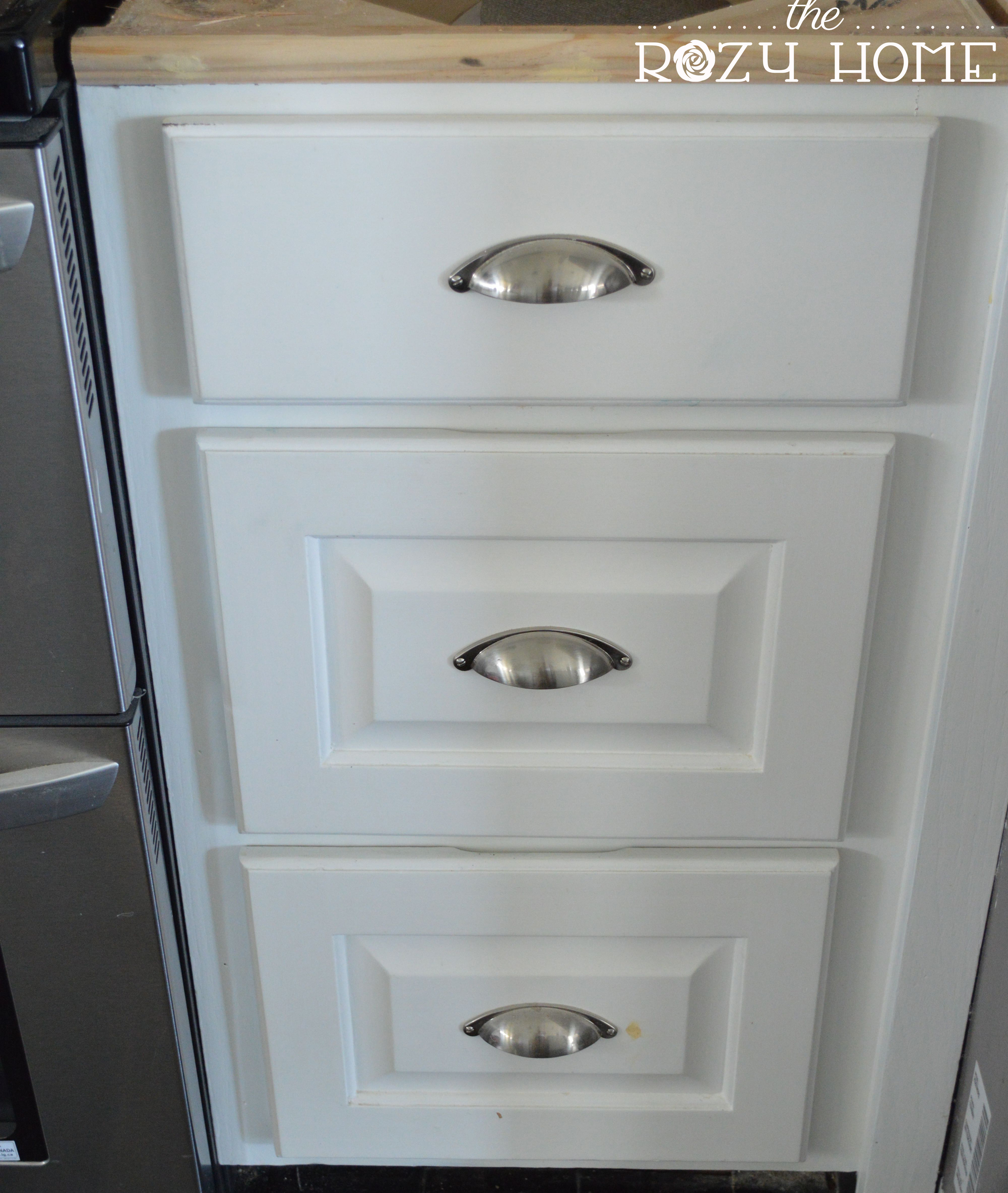 Easy And Inexpensive Cabinet Updates Adding Trim To Cabinets Drawers The Rozy Home