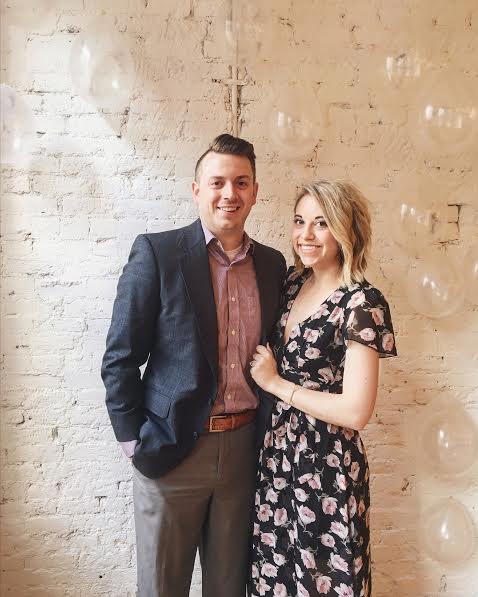 This is a picture of my husband Zac and I, from our opening party at Zurie! I always make fun of his haircut here -- she shaved it down wayyyyy close on that once side. KILLS ME.