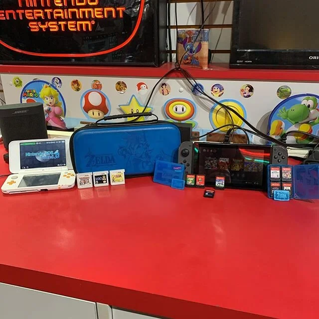 The Switch games are Zelda,Mario Odyssey, Mega man 11,super smash brothers,Mario kart deluxe, Doom, Axiom Verge