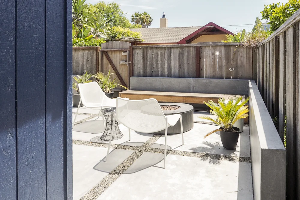 AFTER: The backyard's fire pit and custom built-in bench.