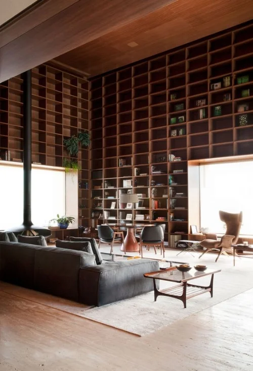 Floor to ceiling bookshelves (image source )