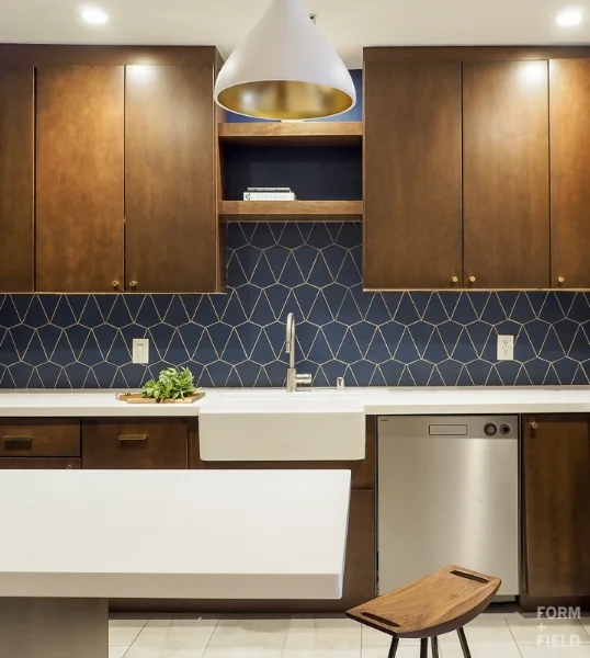 AFTER: Recessed lighting keeps the small space clutter free, while the pendant adds some interest.