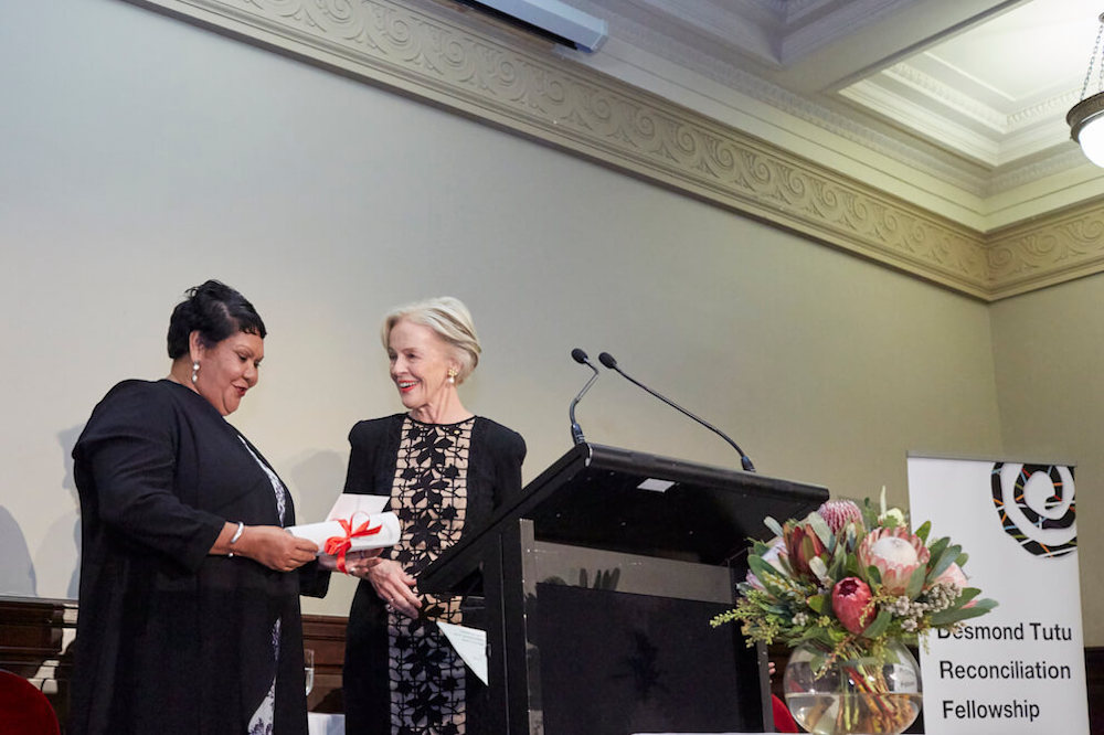 June Oscar AO receives Desmond Tutu Reconciliation Fellowship award at Melbourne Town Hall, 19 May 2016.