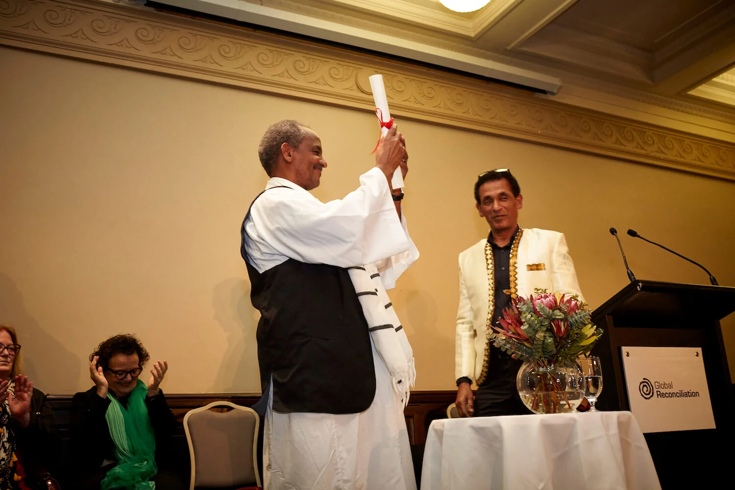 Dr Zeremariam Fre receives Desmond Tutu Reconciliation Fellowship award at Melbourne Town Hall, 4 October 2018.