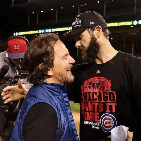 Eddie Vedder celebrating with Cubs ace Jake Arietta after the big win...