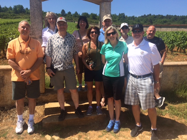 The group in front of the arch at Chevaliers-Montrachet