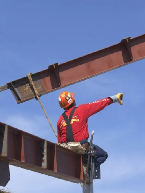 steel ibeams being placed by iron worker.jpg