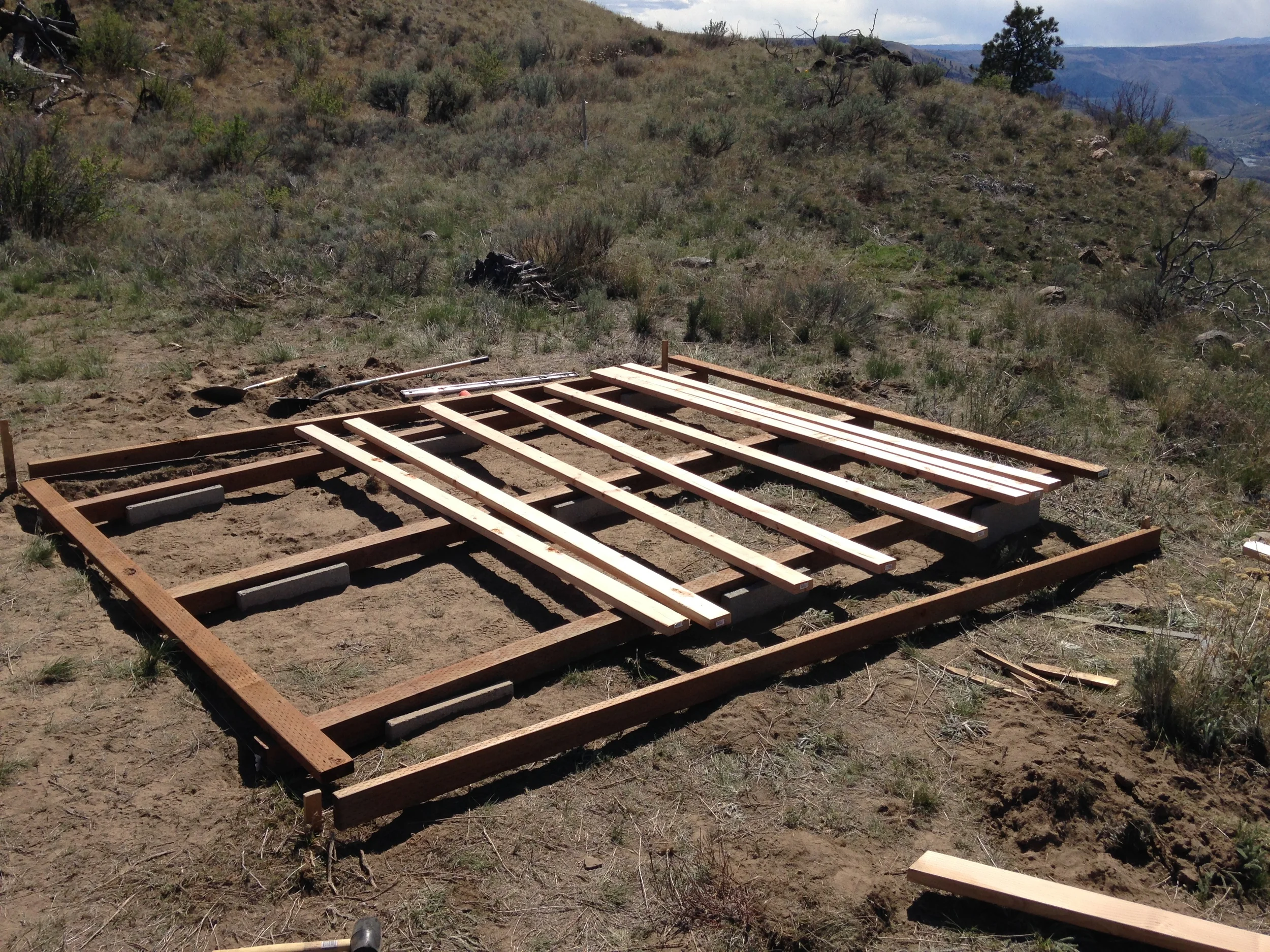 Prepping the joists for the platform in anticipation of Alex's return with a working compressor.