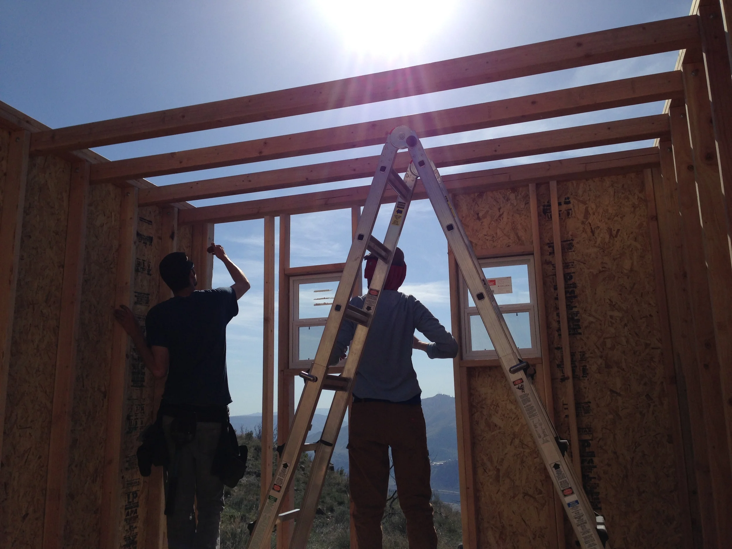 The loft joists comprised two 2x4s screwed together and hung from the top of each wall stud with 3/8" hex bolts. A bit overkill, but we wanted to make sure the sleeping area was solid.