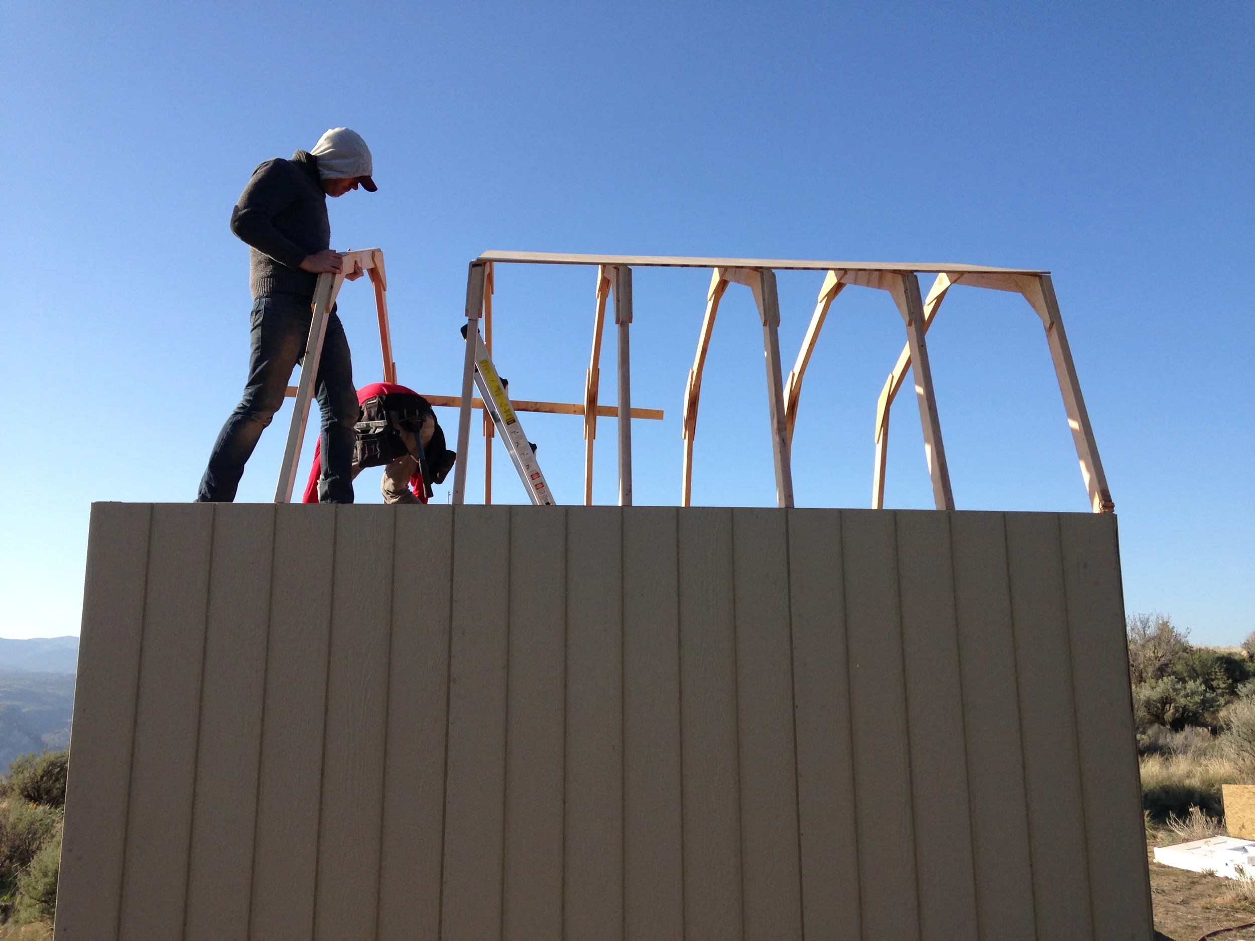 Adding the trusses over the loft was much easier with solid ground to stand on.